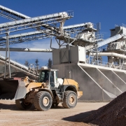 Multi-level conveyors at an industrial plant with a front end loader