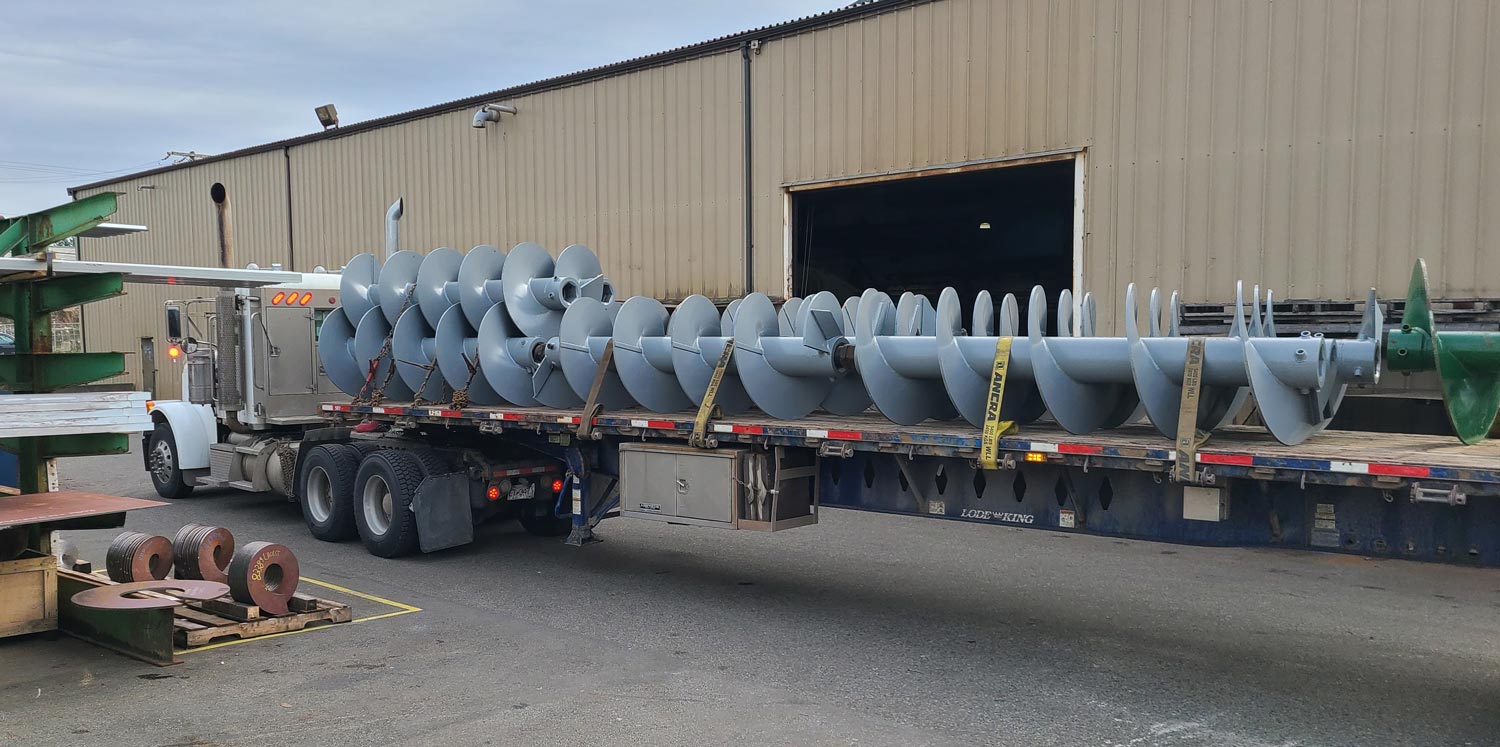 Screw Conveyor Loaded Onto a Truck outside of Helical Works Co